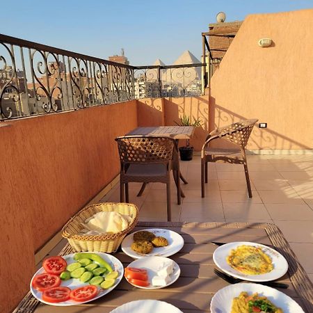 Pyramids Road Guest House Cozy Rooms And Rooftop Breakfast With The Pyramids View Nazlet el-Sisi Экстерьер фото
